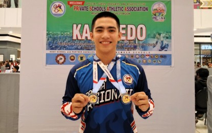 <p><strong>DOUBLE-GOLD WINNER.</strong> Arvin Lim of Soccsksargen wins the men's individual (-75kg) and team gold medals in the Private Schools Athletic Association (PRISAA) National Games karatedo competition at the SM City in Tuguegarao, Cagayan on Thursday (April 10, 2025). He defeated Erin Isaac of Central Visayas in the finals. <em>(Contributed photo)</em></p>