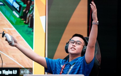 <p><strong>VICTORY.</strong> Paolo Medina of Ateneo de Manila University reacts after beating Keagan Yap of De La Salle University in the UAAP Esports NBA 2K tournament on Tuesday (May 13, 2025) at the Quantum Skyview Deck, Gateway 2 Mall in Quezon City. The Blue Eagles won, 2-1. <em>(UAAP photo)</em></p>
