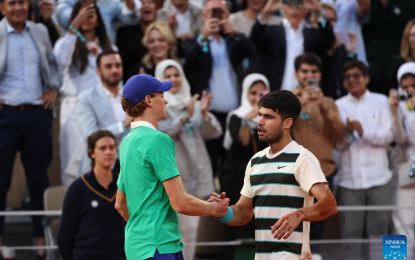 Alcaraz edges Sinner in five to defend French Open title