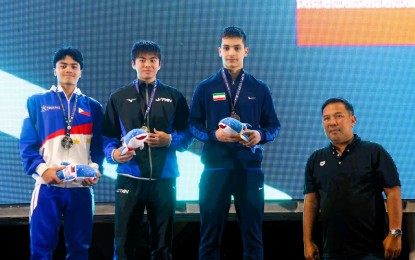 <p><strong>WINNERS.</strong> Silver medalist Jamesray Mishael Ajido from the Philippines (left) with gold medalist Yusei Nishiono of Japan (center) and bronze medalist Yashar Soleimani of Iran on the podium during the medal ceremony of the boys 12-14 50m butterfly event in the 11th Asian Age Group Championships at the New Clark City Aquatics Center in Capas, Tarlac on Thursday (Feb. 29, 2024). Also in photo is Philippine Aquatics Inc. membership committee chairman Anthony Reyes. <em>(Photo courtesy of AAGC)</em></p>