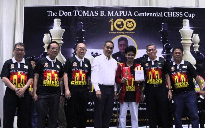 <p><strong>CHAMPION.</strong> Vladimir Lait (5th from left) rules the Rapid category of the Don Tomas Mapua Centennial Chess Cup at Mapua University gym in Intramuros, Manila on Saturday (Jan. 18, 2025). He won PHP10,000 in cash and a trophy. <em>(Contributed photo)</em></p>