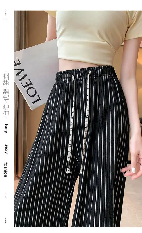 黑色条纹裤怎么搭配上衣图片欣赏